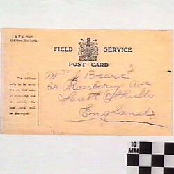 Postcard with typed and handwritten text.