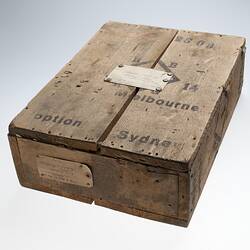 Wooden box with envelope attached to the top.