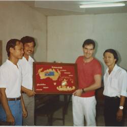 Digital Image - Presentation of Carving to Tony Le Nevez, Phanat Nikhom Camp, Thailand, 1987 - 1989