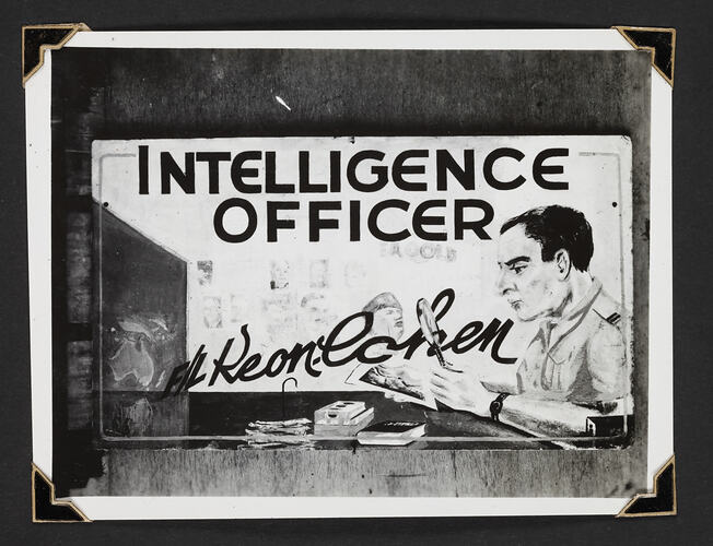 Sign reading 'INTELLIGENCE OFFICER with illustration of man in uniform
