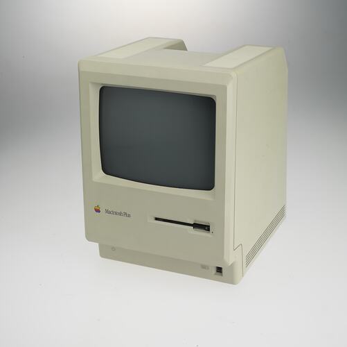 Square, box-like, beige plastic unit with 9 inch screen at front and 3 1/2 inch floppy disc drive below.