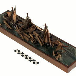 Model of a sailing ship with broken masts.