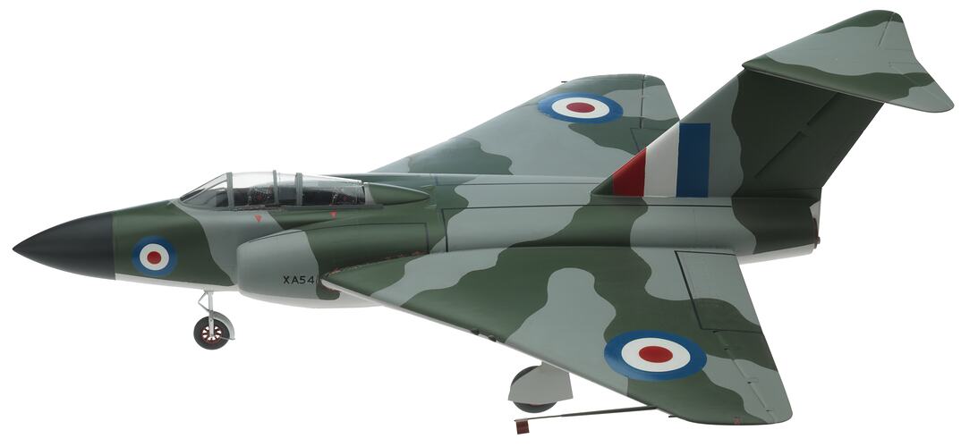 Wooden model grey and green camoflage aeroplane. Two air intakes at front and jets at rear. Black nose cone.