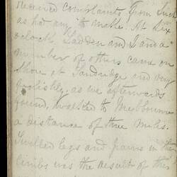Open diary with handwritten text on discoloured worn page.