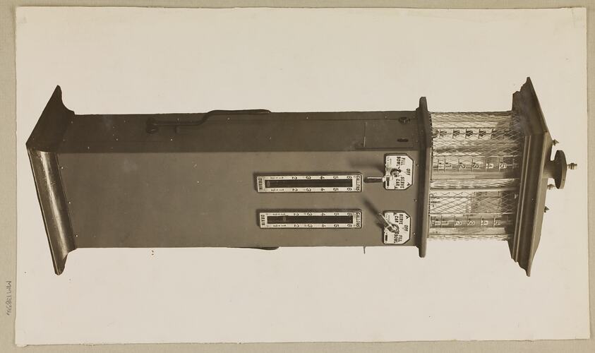 Monochrome photograph of a twin cylinder petrol pump.