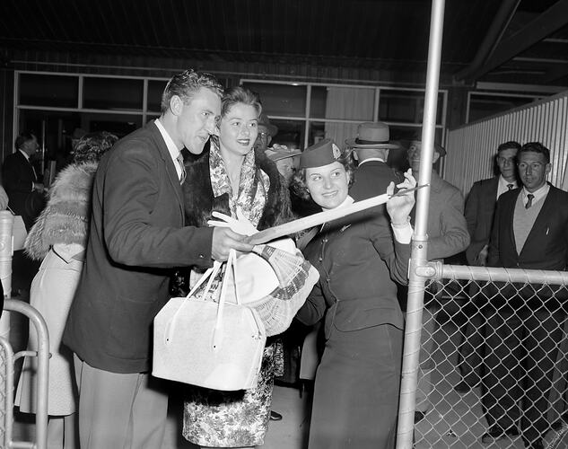 James McEwan & Co, Danny Kaye and Woman at Essendon Airport, Victoria, 15 Oct 1959