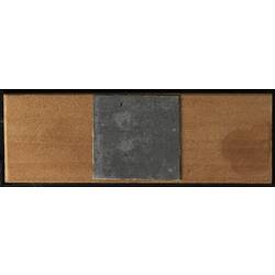 Underside of wooden microslide with metal central panel.