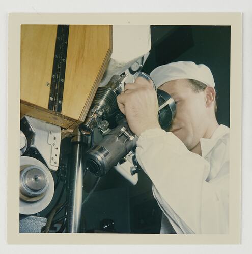 Slide 128, Worker Using Microscope, Kodak Factory, Coburg, 'Extra Prints of Coburg Lecture' album, circa 1960s