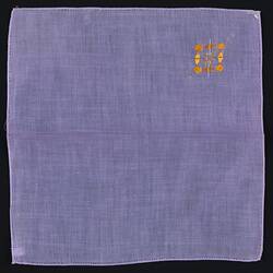 Unfolded Lavender Linen handkerchief with Embroidered Motif.
