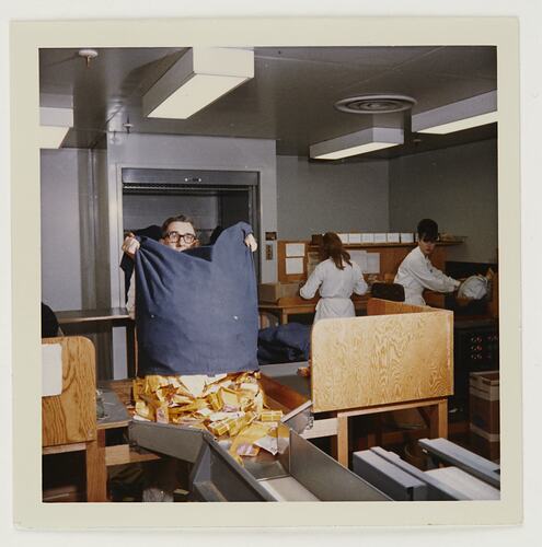 Slide 224, 'Extra Prints of Coburg Lecture', Worker Emptying Mail Bag of Films for Processing, Building 20, Kodak Factory, Coburg, circa 1960s