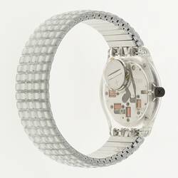 Back of silver wristwatch with gridded band.