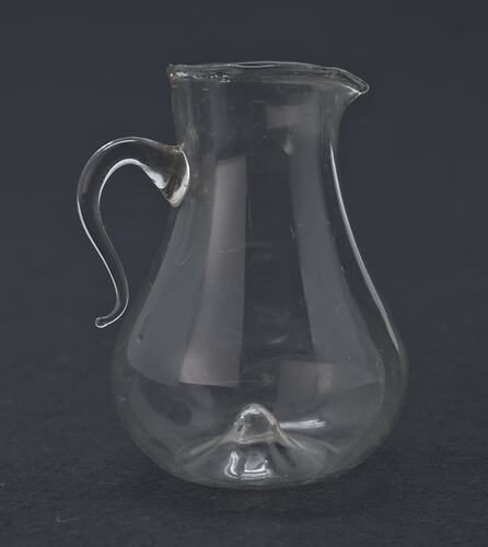 Miniature glass jug from a doll's house.
