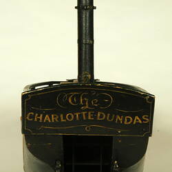 Rear view of wooden paddle steamer model.