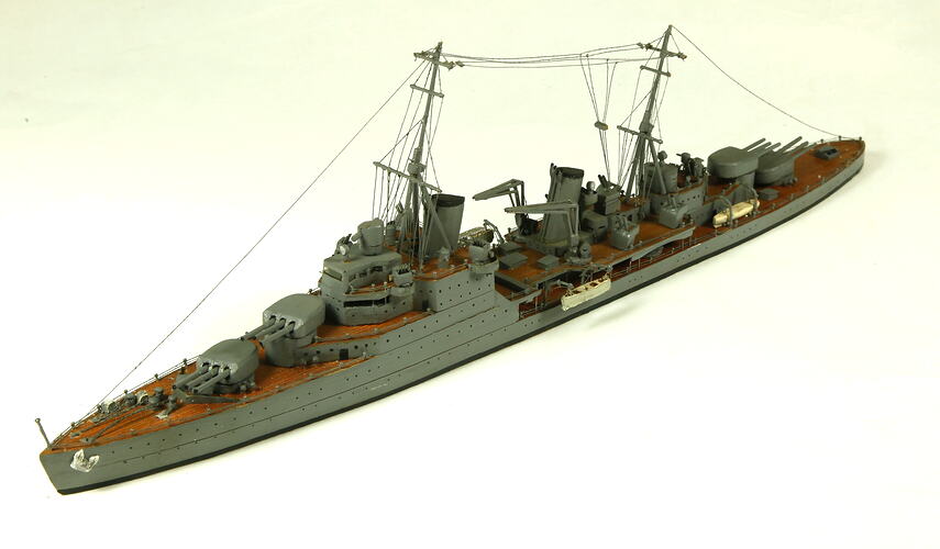 Naval ship with two masts, three quarter view.