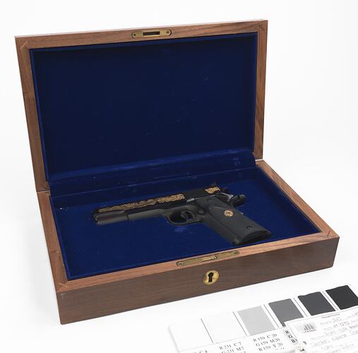 Pistol in wooden case.