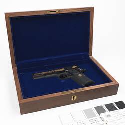 Pistol in wooden case.