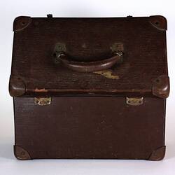 Brown suitcase with lid open.