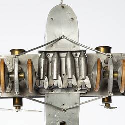 Model of a bi-plane made mostly of aluminium sheet metal. Detail view of underside.