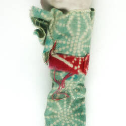 Small Japanese doll in kimono, back side.