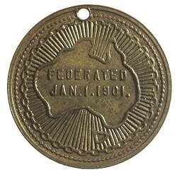 Medal with map of Australia. Hole at top.