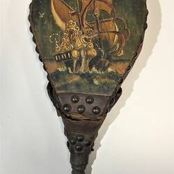 Wooden bellows with sailing ship motif.