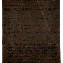 Front of cardboard packet with printed writing.