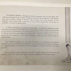 White page with dark blue text. Sketch of snake at lower right.