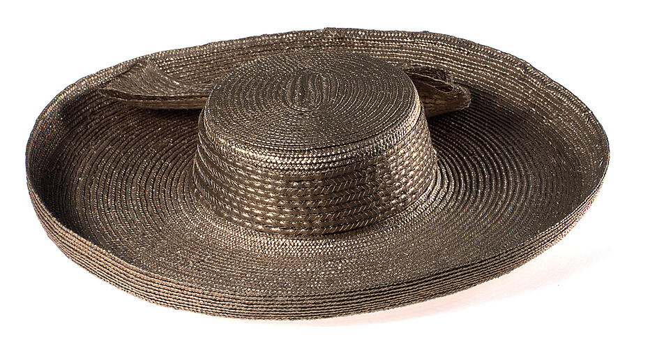 Stylish dark brown straw hat. Wide brim and bow.