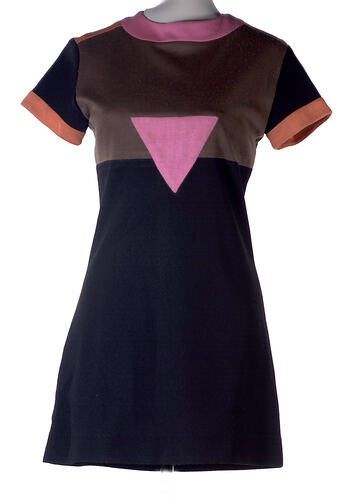 Mini dress, black skirt, brown bodice, pink triangle.