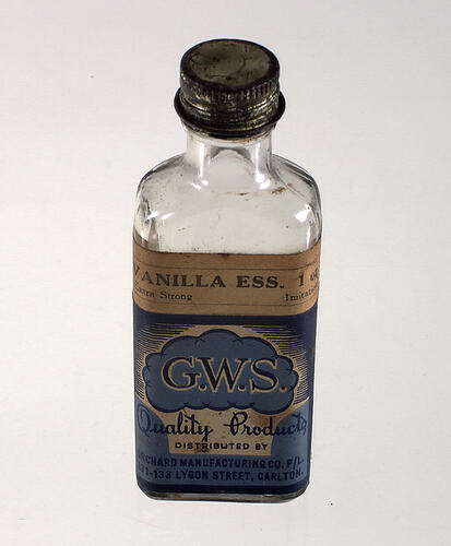 Clear glass bottle with label.