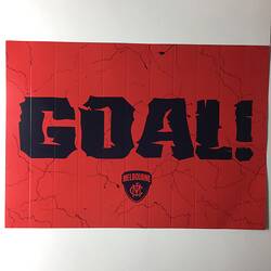 Red placard with printed blue details and text.