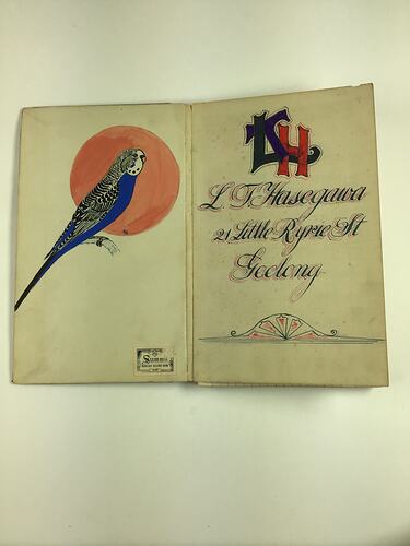 Blue budgie (budgerigar) with red moon behind on left. Decorative text on right side.