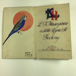 Blue budgie (budgerigar) with red moon behind on left. Decorative text on right side.
