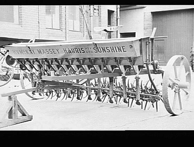 SUNPRONG WITH TRACTOR HITCH ALSO GRASS SEED & FERTILIZER BOXES. JUNE 1954