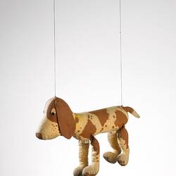 Left view of spotted dog puppet.