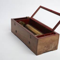 Wooden rectangular box. Open glass section on top on box.