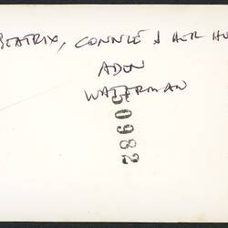Discoloured white back of photograph with handwriting.