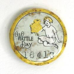 Badge with yellow border and blue background, with child holding a yellow wattle sprig and black text below.