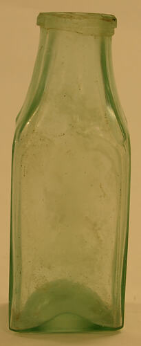 Glass bottle, light green colour.
