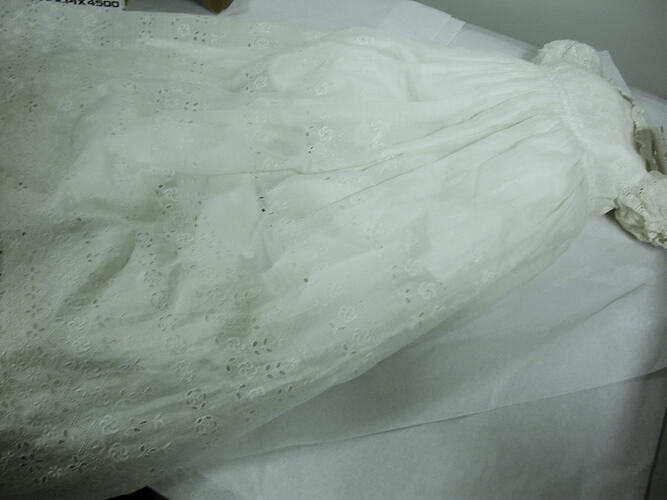 White christening gown with embroidered flowers