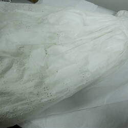 White christening gown with embroidered flowers