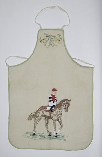 Apron with horse, jockey and emblem embroidery.