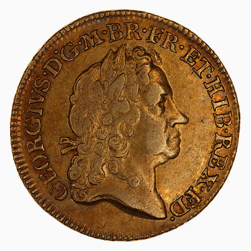 Gold coin with emperor head.