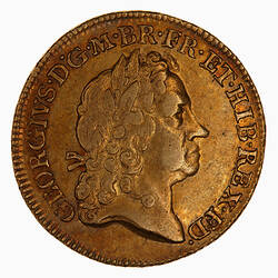 Gold coin with emperor head.