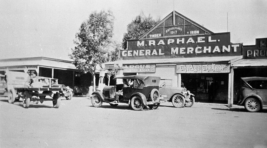 Motor cars in front of Raphael 's General Store.