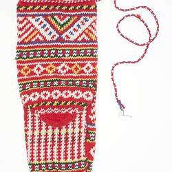 Patterned sock, predominantly red, string attached at top.