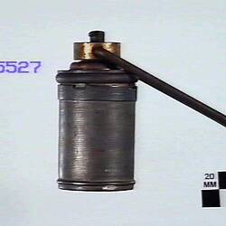 Side view of metal detonator.