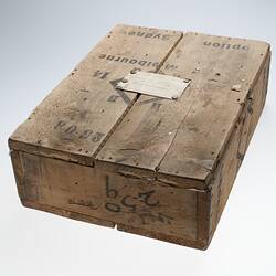 Wooden box with envelope attached to the top.