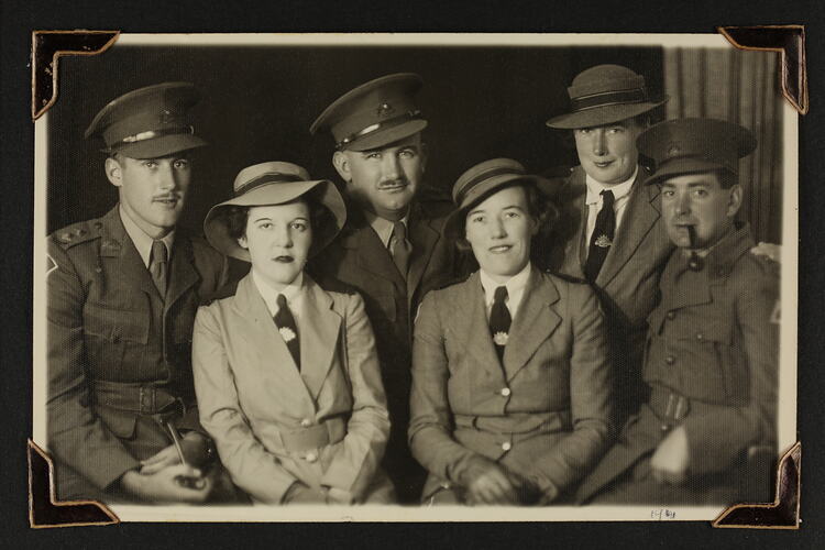Studio portrait of six servicemen and women in military uniform.
