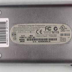 Silver 'Compaq' pocket PC, back view.